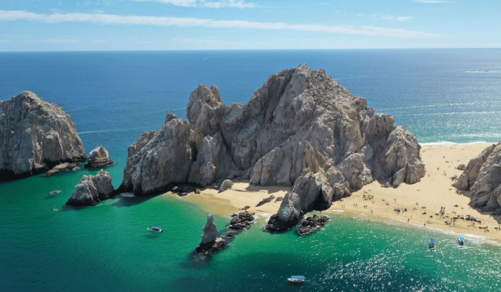 A mesmerizing view of Cabo San Lucas showcasing its iconic rock formations, where the Sea of Cortez meets the Pacific Ocean.
