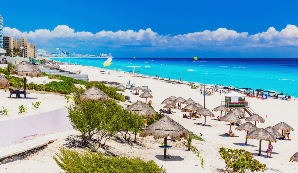 Sun-kissed Cancun beach with powdery white sand and the pristine turquoise waters of the Caribbean Sea.